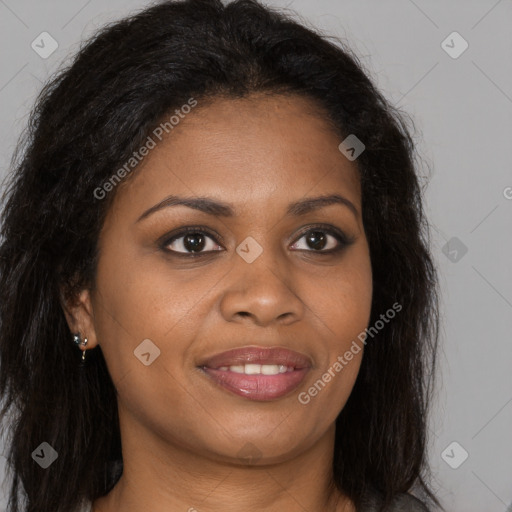 Joyful black young-adult female with long  brown hair and brown eyes
