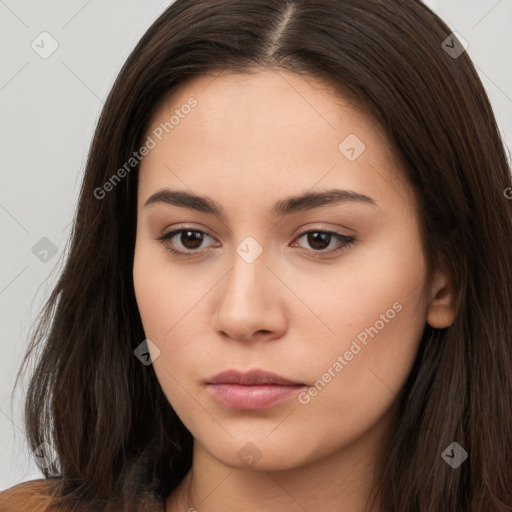 Neutral white young-adult female with long  brown hair and brown eyes