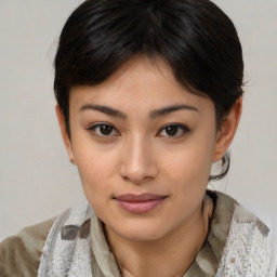 Joyful asian young-adult female with medium  brown hair and brown eyes