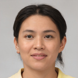 Joyful white young-adult female with medium  brown hair and brown eyes