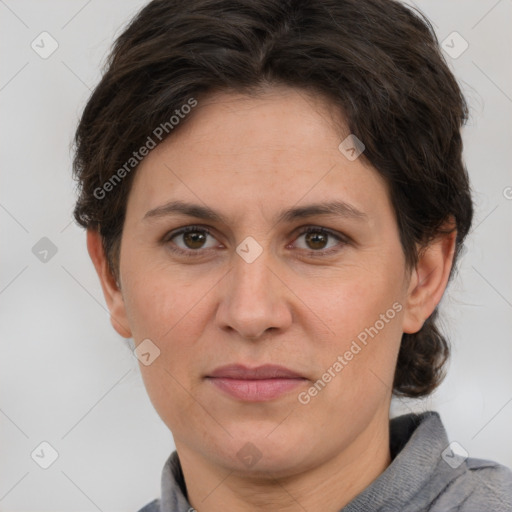 Joyful white adult female with medium  brown hair and grey eyes