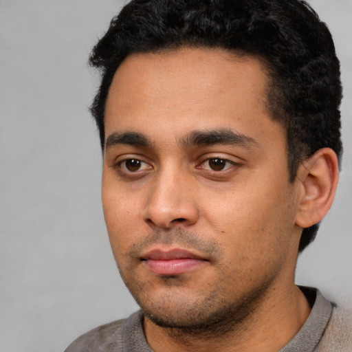Neutral white young-adult male with short  black hair and brown eyes