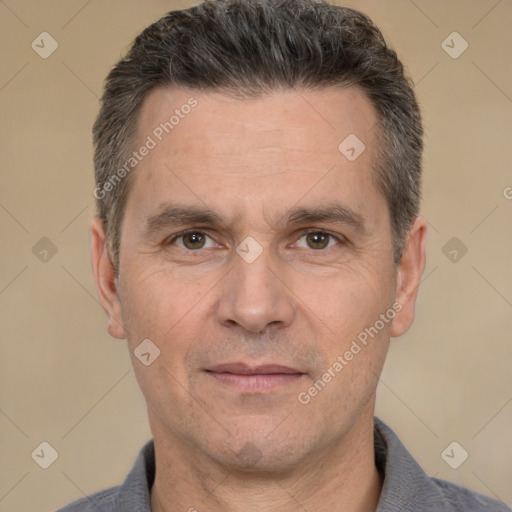 Joyful white adult male with short  black hair and brown eyes