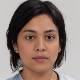 Neutral asian young-adult female with medium  brown hair and brown eyes