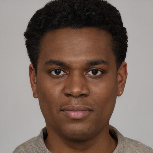 Neutral black young-adult male with short  brown hair and brown eyes