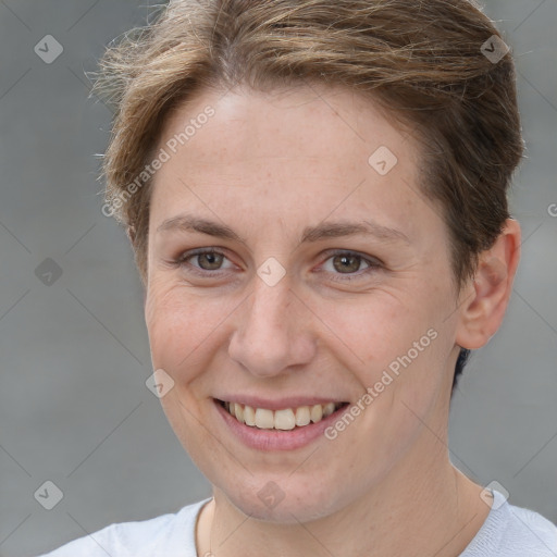 Joyful white young-adult female with short  brown hair and grey eyes