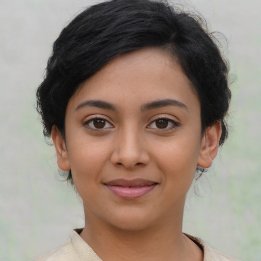 Joyful latino young-adult female with medium  black hair and brown eyes