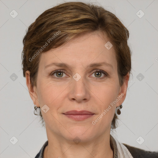 Joyful white adult female with medium  brown hair and grey eyes