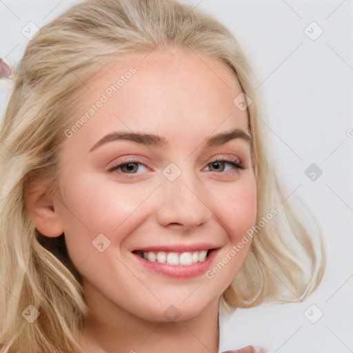 Joyful white young-adult female with long  brown hair and blue eyes