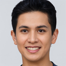 Joyful asian young-adult male with short  black hair and brown eyes