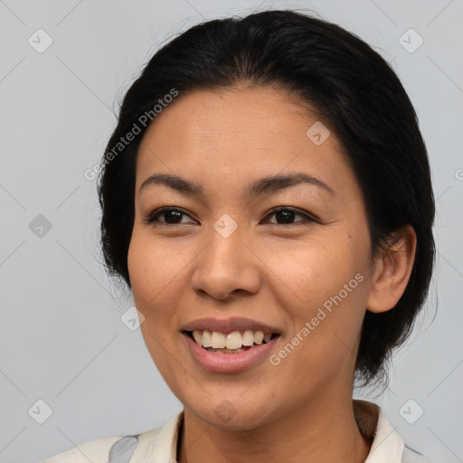 Joyful asian young-adult female with medium  brown hair and brown eyes