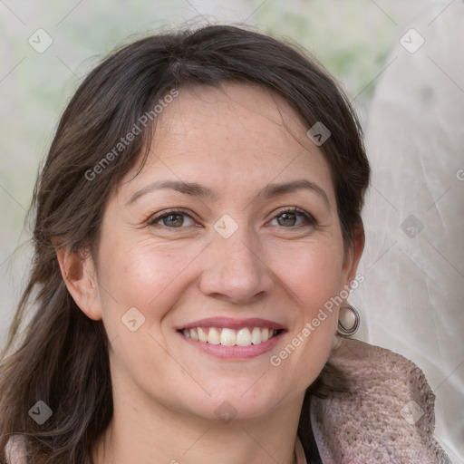 Joyful white adult female with medium  brown hair and grey eyes