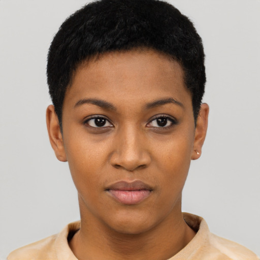 Joyful black young-adult female with short  black hair and brown eyes
