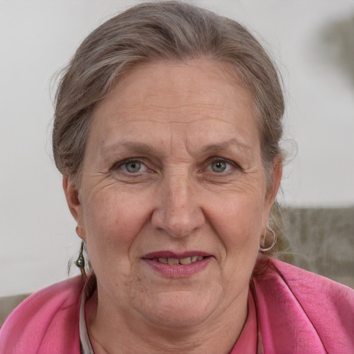 Joyful white middle-aged female with medium  brown hair and blue eyes