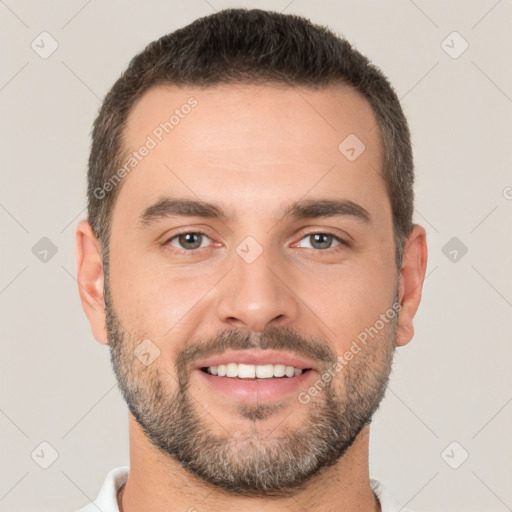 Joyful white young-adult male with short  brown hair and brown eyes