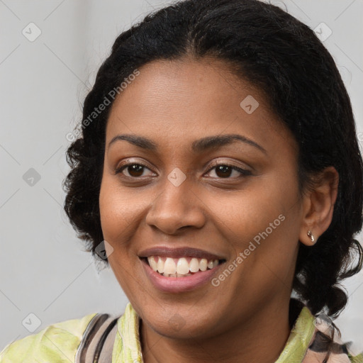 Joyful black young-adult female with long  brown hair and brown eyes