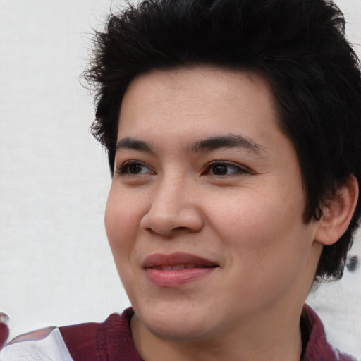 Joyful asian young-adult female with medium  black hair and brown eyes