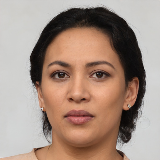 Neutral latino young-adult female with medium  black hair and brown eyes