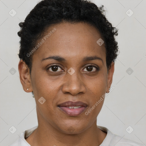 Joyful black adult female with short  black hair and brown eyes