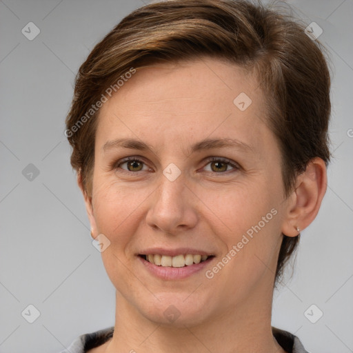 Joyful white adult female with short  brown hair and grey eyes