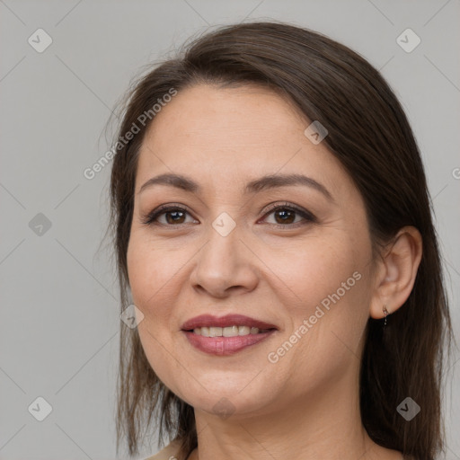 Joyful white adult female with medium  brown hair and brown eyes