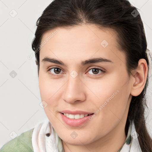 Joyful white young-adult female with medium  brown hair and brown eyes