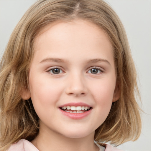 Joyful white child female with medium  brown hair and brown eyes