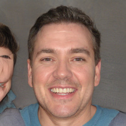 Joyful white adult male with short  brown hair and brown eyes