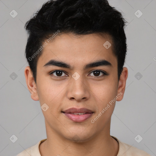 Joyful latino young-adult male with short  brown hair and brown eyes