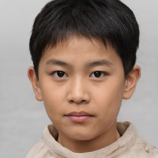 Neutral asian child male with short  brown hair and brown eyes