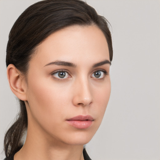 Neutral white young-adult female with medium  brown hair and brown eyes