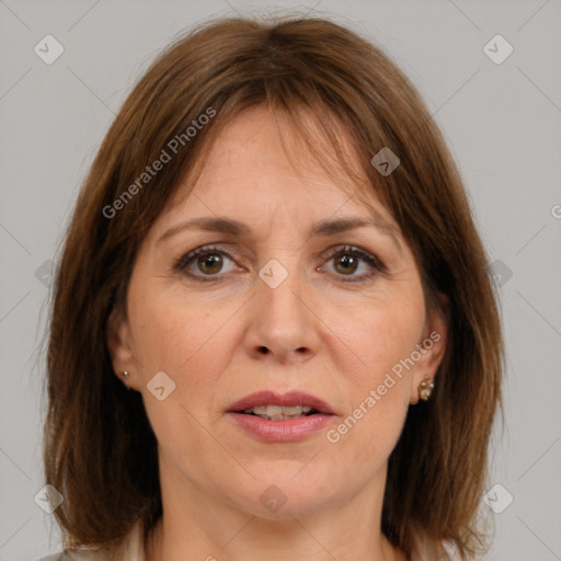 Joyful white adult female with medium  brown hair and brown eyes