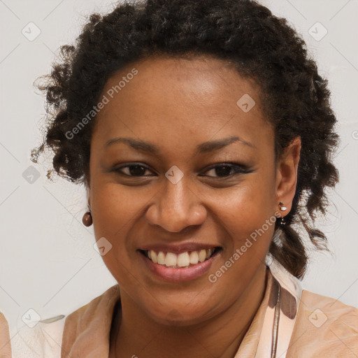 Joyful black young-adult female with long  brown hair and brown eyes