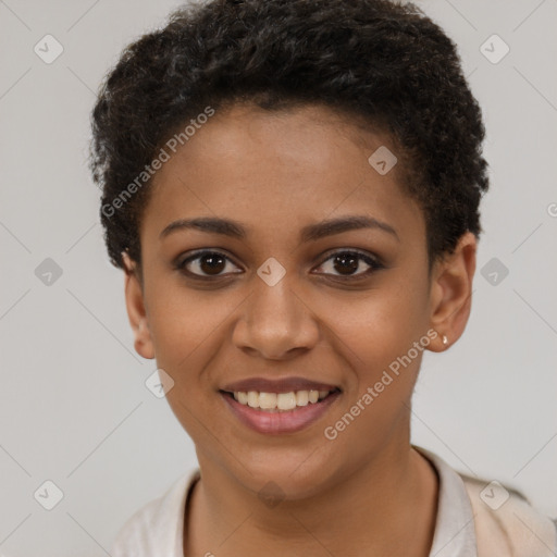 Joyful black young-adult female with short  brown hair and brown eyes