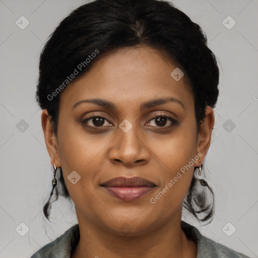 Joyful latino young-adult female with short  black hair and brown eyes