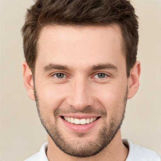 Joyful white young-adult male with short  brown hair and brown eyes