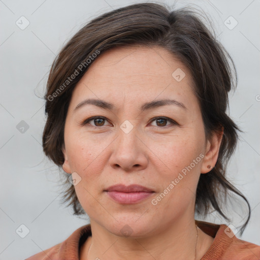 Joyful white adult female with medium  brown hair and brown eyes