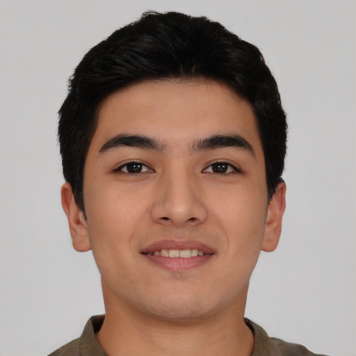 Joyful asian young-adult male with short  black hair and brown eyes