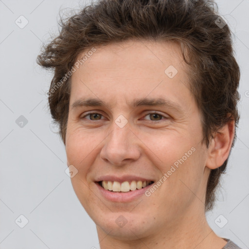 Joyful white adult female with short  brown hair and brown eyes