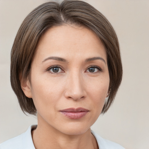 Neutral white young-adult female with medium  brown hair and brown eyes