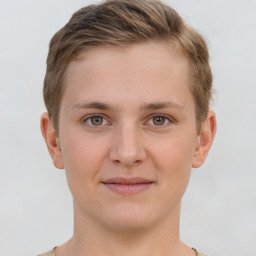 Joyful white young-adult female with short  brown hair and grey eyes