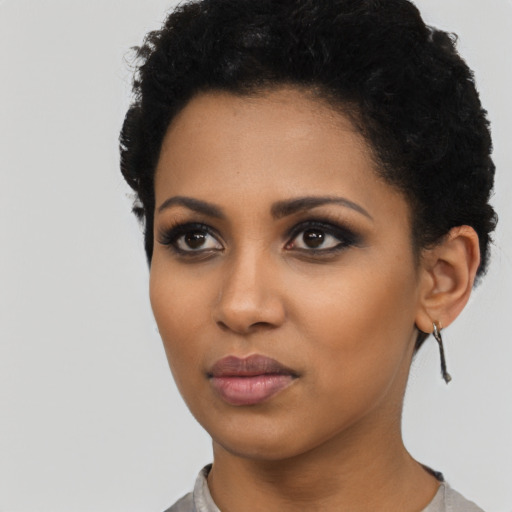 Neutral latino young-adult female with short  black hair and brown eyes