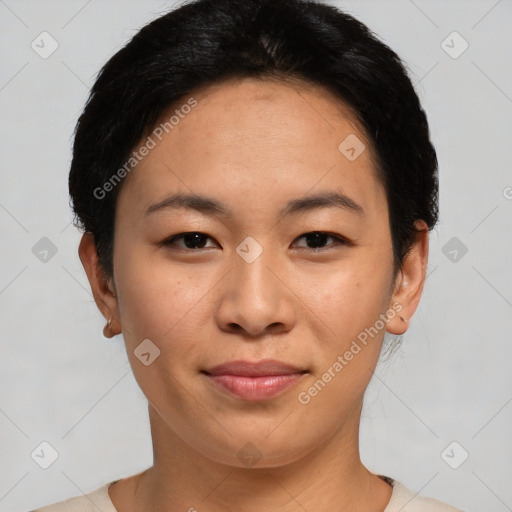 Joyful asian young-adult female with short  black hair and brown eyes