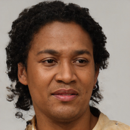 Joyful black adult female with short  brown hair and brown eyes