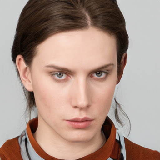 Neutral white young-adult female with medium  brown hair and grey eyes