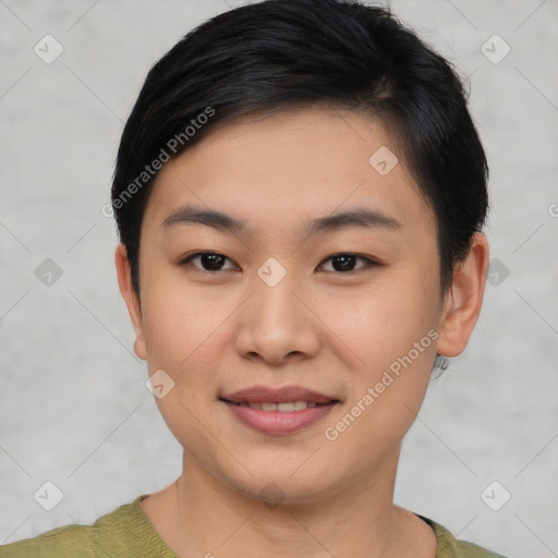 Joyful asian young-adult female with short  brown hair and brown eyes