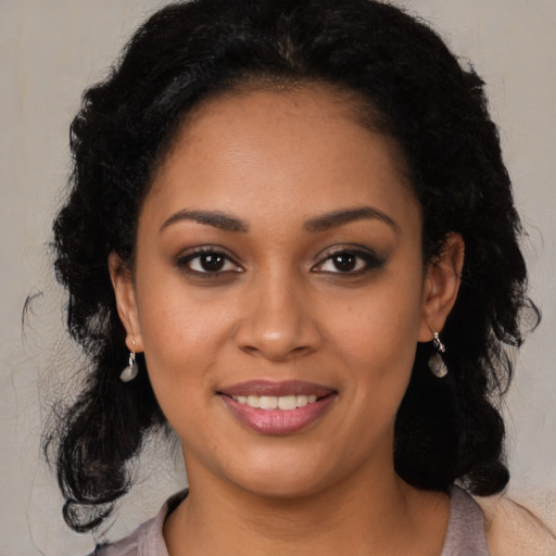 Joyful latino young-adult female with medium  black hair and brown eyes