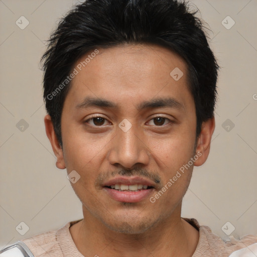 Joyful white young-adult male with short  black hair and brown eyes