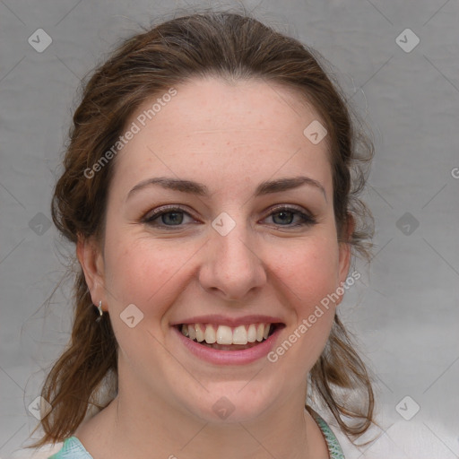 Joyful white young-adult female with medium  brown hair and blue eyes