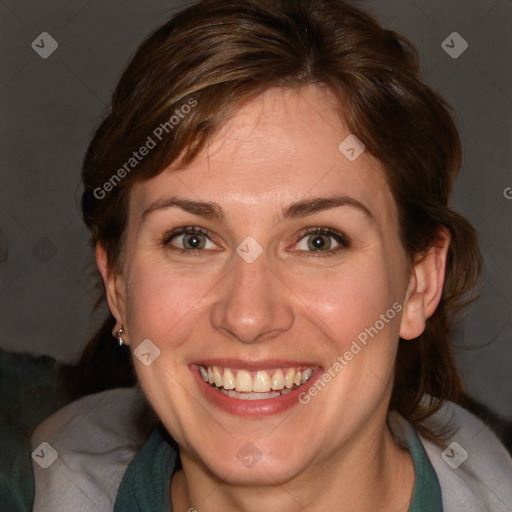 Joyful white adult female with medium  brown hair and blue eyes
